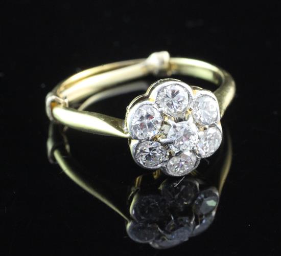 An 18ct gold, platinum and diamond cluster ring, size J.